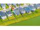 Aerial view of a neighborhood with pond, lawns, and mature trees at 1689 Eider Down Dr, Summerville, SC 29483