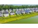 An aerial view of a neighborhood featuring homes backing up to a scenic pond at 1689 Eider Down Dr, Summerville, SC 29483