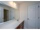 Bright bathroom features a large mirror over vanity and convenient access to shower and storage at 1689 Eider Down Dr, Summerville, SC 29483