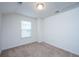 Bright bedroom with a window and neutral carpeting providing a comfortable living space at 1689 Eider Down Dr, Summerville, SC 29483