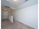 Hallway with carpet flooring, white walls, and a door, leading to different areas of the home at 1689 Eider Down Dr, Summerville, SC 29483