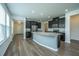 Modern kitchen features dark cabinets, stainless steel appliances, and a granite island at 1689 Eider Down Dr, Summerville, SC 29483
