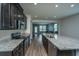 Well-equipped kitchen featuring granite countertops, stainless steel appliances, and dark cabinetry at 1689 Eider Down Dr, Summerville, SC 29483