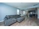 Comfortable living room features hardwood floors, an open concept design, and large sofa at 1689 Eider Down Dr, Summerville, SC 29483