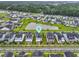 Aerial view of a lovely community with well-maintained homes surrounding a pond at 1832 Agate Bay Dr, Mount Pleasant, SC 29466