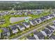 Neighborhood aerial view featuring well-maintained homes, scenic pond, and community landscaping at 1832 Agate Bay Dr, Mount Pleasant, SC 29466