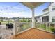 Outdoor back porch featuring wood floors, string lights, and a patio with a grill and dining area at 1832 Agate Bay Dr, Mount Pleasant, SC 29466