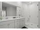 Modern bathroom with double sinks, vanity, and a glass-enclosed shower at 1832 Agate Bay Dr, Mount Pleasant, SC 29466