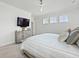 Comfortable bedroom featuring neutral decor, a ceiling fan, and ample natural light at 1832 Agate Bay Dr, Mount Pleasant, SC 29466