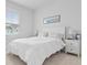 Cozy bedroom featuring bright natural light, a white bed, and side tables at 1832 Agate Bay Dr, Mount Pleasant, SC 29466