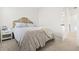 Well-lit bedroom featuring neutral decor, a bed with a patterned bedspread, and a side table at 1832 Agate Bay Dr, Mount Pleasant, SC 29466