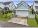 Charming home with a well-manicured lawn, complemented by black fencing for added privacy and curb appeal at 1832 Agate Bay Dr, Mount Pleasant, SC 29466