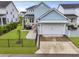 Charming home with a well-manicured lawn, complemented by black fencing for added privacy and curb appeal at 1832 Agate Bay Dr, Mount Pleasant, SC 29466