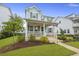 Charming two-story home with inviting front porch and well-manicured landscaping in a friendly neighborhood at 1832 Agate Bay Dr, Mount Pleasant, SC 29466