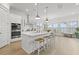 Bright, modern kitchen featuring a large center island with seating, stainless steel appliances, and ample counter space at 1832 Agate Bay Dr, Mount Pleasant, SC 29466