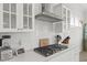Modern kitchen featuring stainless steel appliances, white cabinetry, and a stylish backsplash, perfect for culinary enthusiasts at 1832 Agate Bay Dr, Mount Pleasant, SC 29466
