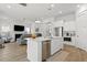 Modern kitchen with an island, stainless steel appliances, and an open floor plan leading to the living area at 1832 Agate Bay Dr, Mount Pleasant, SC 29466
