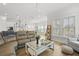 Comfortable living room with an open floor plan, visible kitchen and dining areas, and plenty of natural light at 1832 Agate Bay Dr, Mount Pleasant, SC 29466