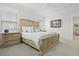 Comfortable main bedroom features a king bed, neutral color scheme, and natural light from two large windows at 1832 Agate Bay Dr, Mount Pleasant, SC 29466