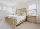 Serene main bedroom features a king-size bed, neutral decor, and natural light from the windows at 1832 Agate Bay Dr, Mount Pleasant, SC 29466