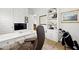 This is a well-designed home office with a white desk, golf clubs, and a comfortable leather chair at 1832 Agate Bay Dr, Mount Pleasant, SC 29466