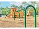 Community playground featuring wood mulch surface, swings, climbing structures, and slides at 1832 Agate Bay Dr, Mount Pleasant, SC 29466