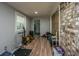 Spacious basement featuring wood look floors, a large window, and a cool wood plank feature wall at 1917 Piper Dr, Charleston, SC 29407