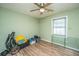 Empty bedroom with wood floors, a ceiling fan, and a window with natural light at 1917 Piper Dr, Charleston, SC 29407
