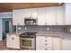 Well-appointed kitchen featuring granite countertops, stainless steel appliances, and custom cabinetry at 1917 Piper Dr, Charleston, SC 29407