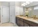 Bathroom features a double vanity, marble countertops, and ample storage space at 1928 Mossdale Dr, Johns Island, SC 29455