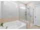 Bathroom features a soaking tub and a glass door shower, providing a relaxing space at 1928 Mossdale Dr, Johns Island, SC 29455