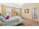 Comfortable bedroom featuring two bright windows and neutral carpeting throughout at 1928 Mossdale Dr, Johns Island, SC 29455