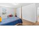 Bright bedroom with a four-poster bed, a study desk, and carpeted floor at 1928 Mossdale Dr, Johns Island, SC 29455