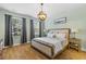 Cozy bedroom with hardwood floors, natural light, and a view of the outdoors at 1928 Mossdale Dr, Johns Island, SC 29455