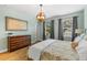 Spacious bedroom featuring hardwood floors, natural lighting, and neutral color scheme at 1928 Mossdale Dr, Johns Island, SC 29455