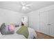 Inviting bedroom with carpet, ceiling fan, and a glimpse into the hallway at 1928 Mossdale Dr, Johns Island, SC 29455
