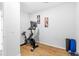 Bright workout space with a stationary bike and yoga mat on light wood-look flooring at 1928 Mossdale Dr, Johns Island, SC 29455