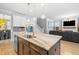 Kitchen island with pendant lighting and ample seating, opening into the living area at 1928 Mossdale Dr, Johns Island, SC 29455