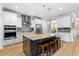 Bright kitchen featuring white cabinetry, stainless steel appliances, and a large center island at 1928 Mossdale Dr, Johns Island, SC 29455