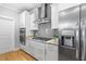Modern kitchen with stainless steel appliances, gas cooktop, gray tile backsplash, and ample cabinetry at 1928 Mossdale Dr, Johns Island, SC 29455