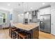 Bright kitchen featuring white cabinetry, stainless steel appliances, and a large center island at 1928 Mossdale Dr, Johns Island, SC 29455