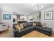 Open-concept living room flows into a modern kitchen with an island and stainless steel appliances at 1928 Mossdale Dr, Johns Island, SC 29455
