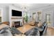 Cozy living room with a fireplace, large windows, and comfortable seating at 1928 Mossdale Dr, Johns Island, SC 29455