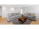 Upstairs living room featuring two large sofas, wood floors, and recessed lighting at 1928 Mossdale Dr, Johns Island, SC 29455