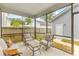 Cozy screened patio with seating, perfect for relaxing outdoors at 1928 Mossdale Dr, Johns Island, SC 29455