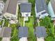 Aerial view showcases the home's backyard, neighboring houses, and surrounding landscape at 205 White Gables Dr, Summerville, SC 29483