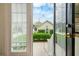 Charming backyard view through open door, showcasing outdoor space and string lights at 205 White Gables Dr, Summerville, SC 29483