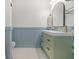 Stylish bathroom featuring a green vanity, hexagon tile flooring and beadboard accent at 205 White Gables Dr, Summerville, SC 29483