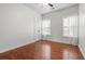 Bright bedroom with hardwood floors, ceiling fan, and natural light from two windows at 205 White Gables Dr, Summerville, SC 29483