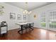 Dining area featuring a modern light fixture, table with seating for six, and patio access at 205 White Gables Dr, Summerville, SC 29483
